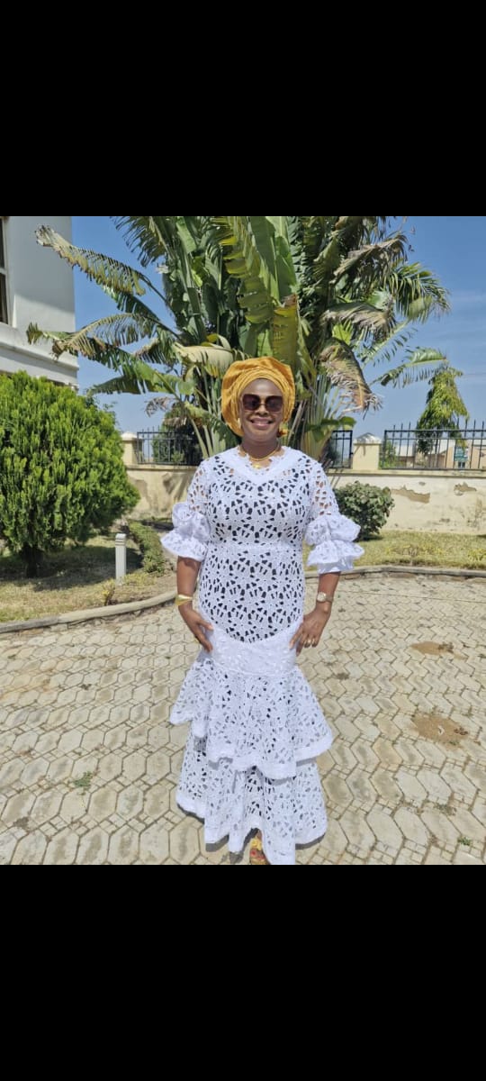 White eyelet lace tiered gown with gold gele